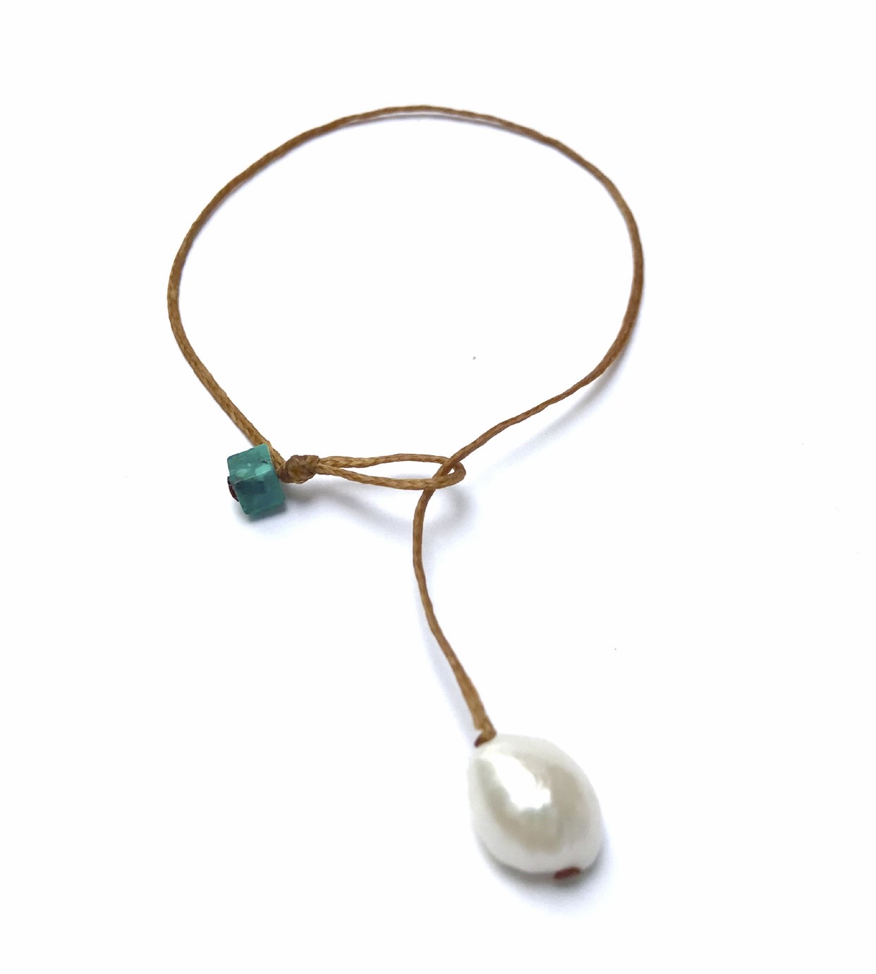 Handmade bracelet made as a single large pearl drop serving as bracelet clasp, weight and adornment. Single turquoise bead. Essence of simplicity. One size