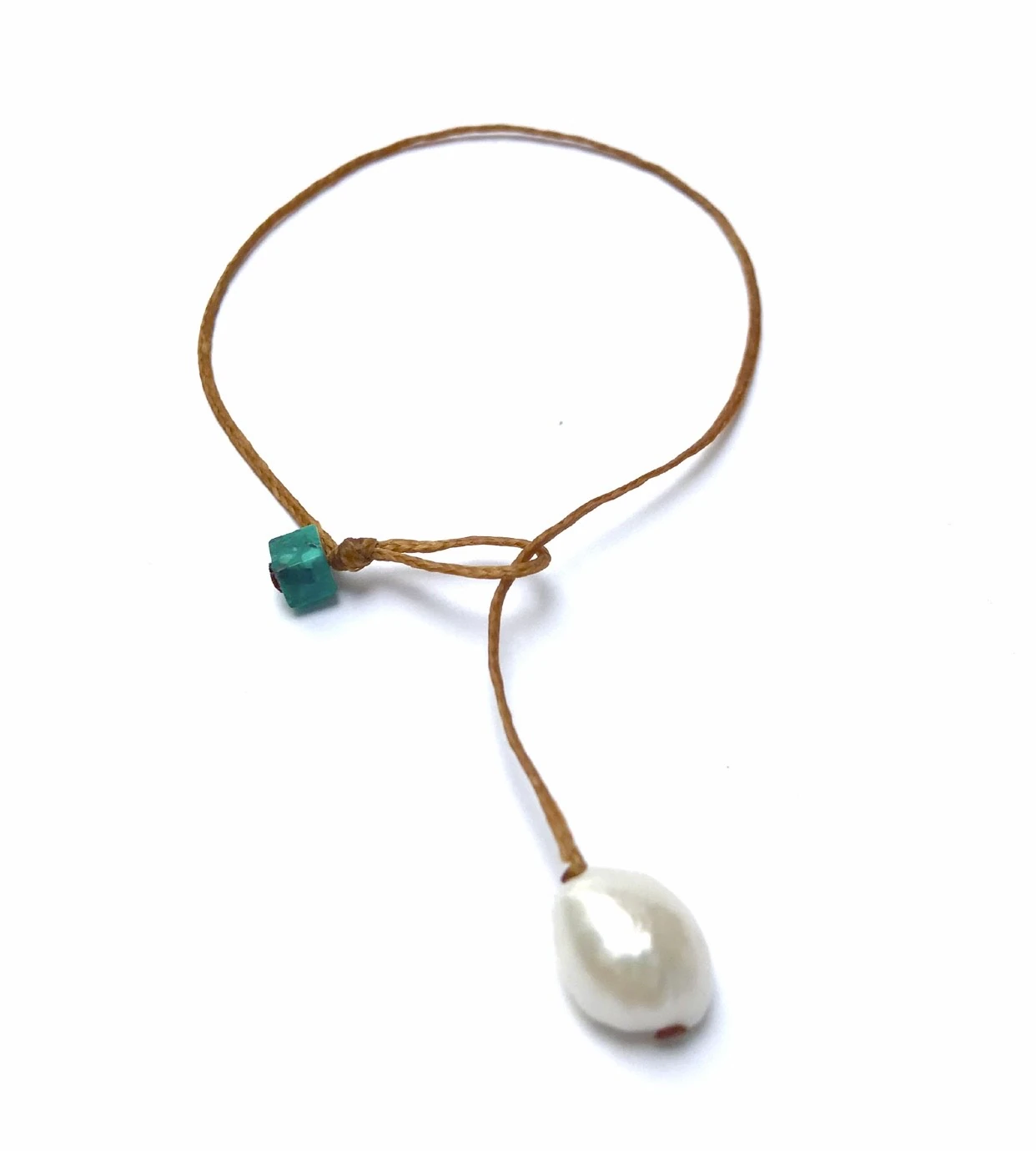 Handmade bracelet made as a single large pearl drop serving as bracelet clasp, weight and adornment. Single turquoise bead. Essence of simplicity. One size