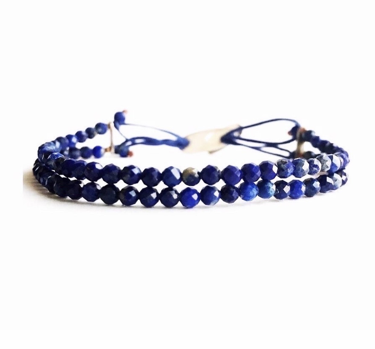 Handmade bracelet with two rows of quality blue lapis lazuli round faceted beads. Because two is better than one and lapis is our favorite gemstone. Amaranthine signature handmade silver clasp too keep them together.